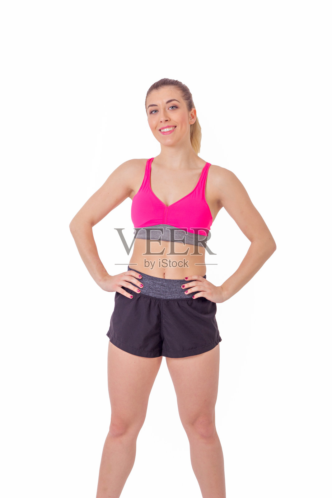 健康的女人准备锻炼看着摄像机在白色的背景。照片摄影图片