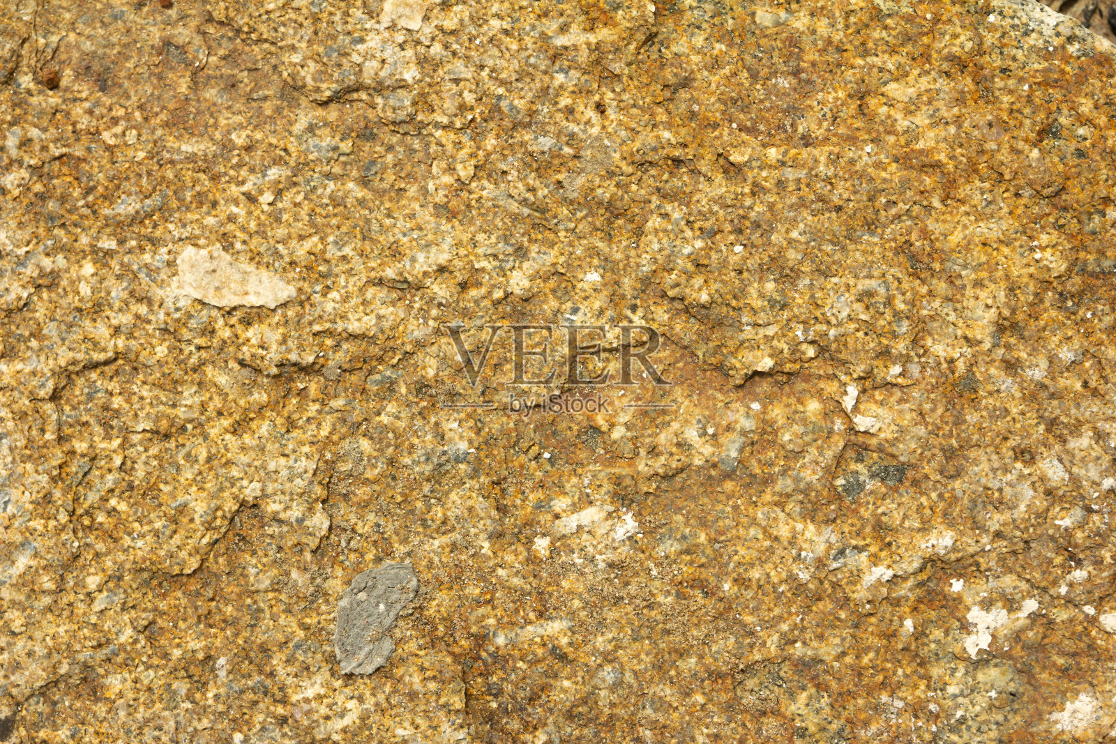 花岗岩的纹理和背景。花岗岩被用作墓碑和纪念碑。花岗岩是一种坚硬的石头，需要手工雕刻的技巧。照片摄影图片