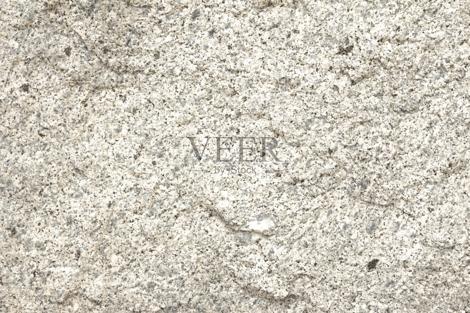 花岗岩的纹理和背景。花岗岩被用作墓碑和纪念碑。花岗岩是一种坚硬的石头，需要手工雕刻的技巧。照片摄影图片