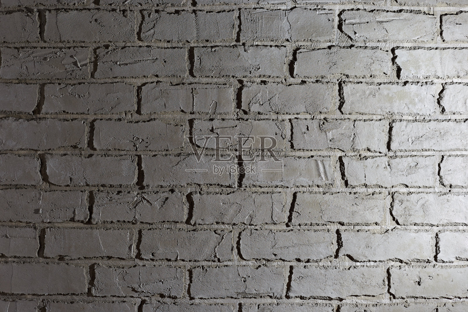 灰泥在墙面上以砖墙的形式修补和装饰墙面，用水泥制成照片摄影图片