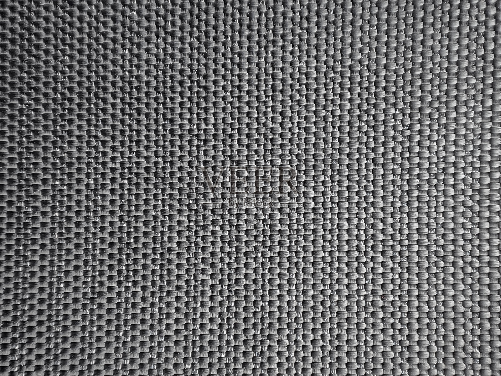 特写黑色塑料垫。背景纹理与交织的带子。照片摄影图片