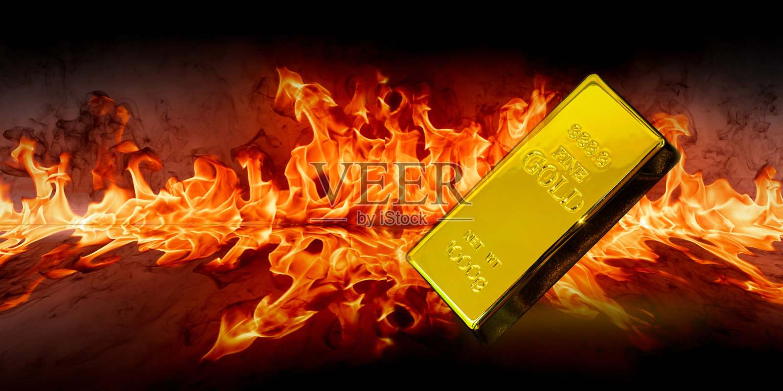 金块在火焰火焰燃烧黑色背景照片摄影图片