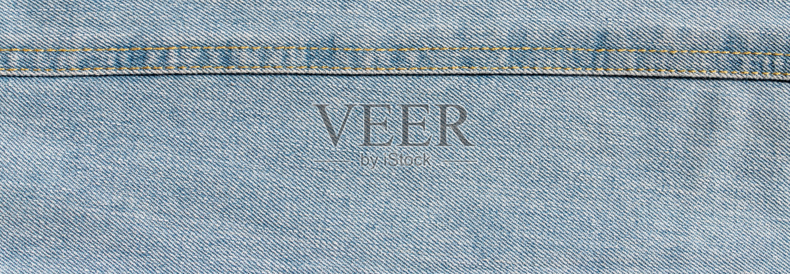 质地以浅蓝色牛仔布为背景照片摄影图片