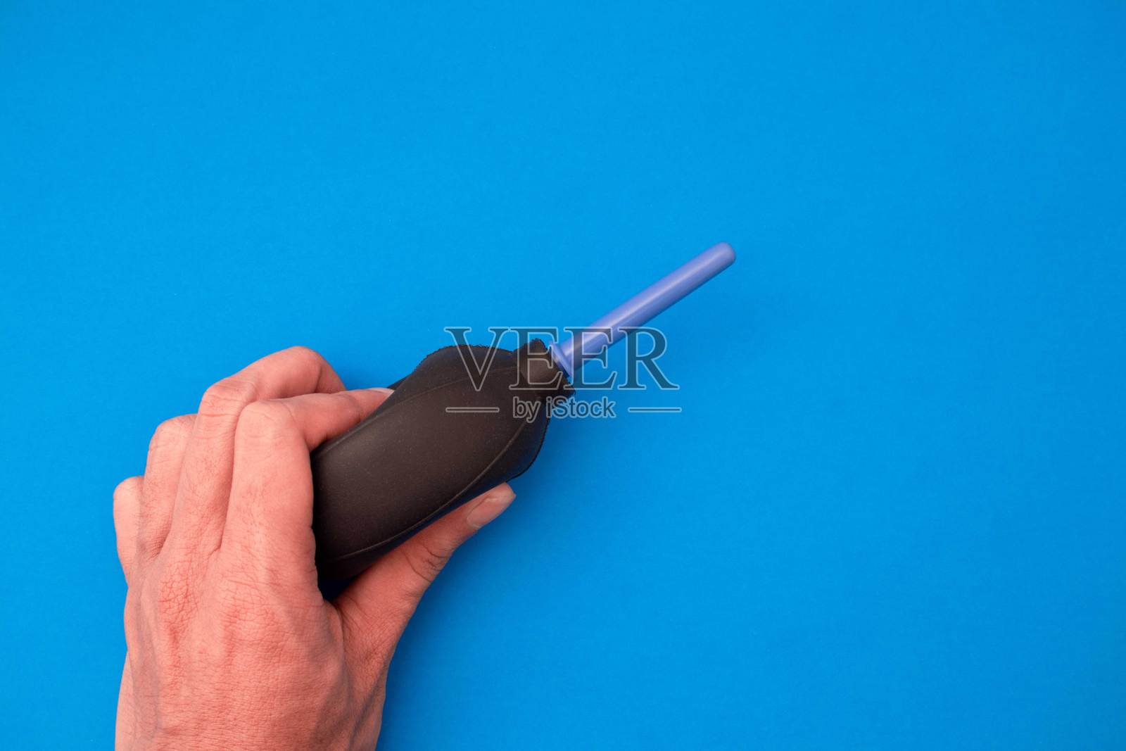 手持摄像机清洗真空泵照片摄影图片