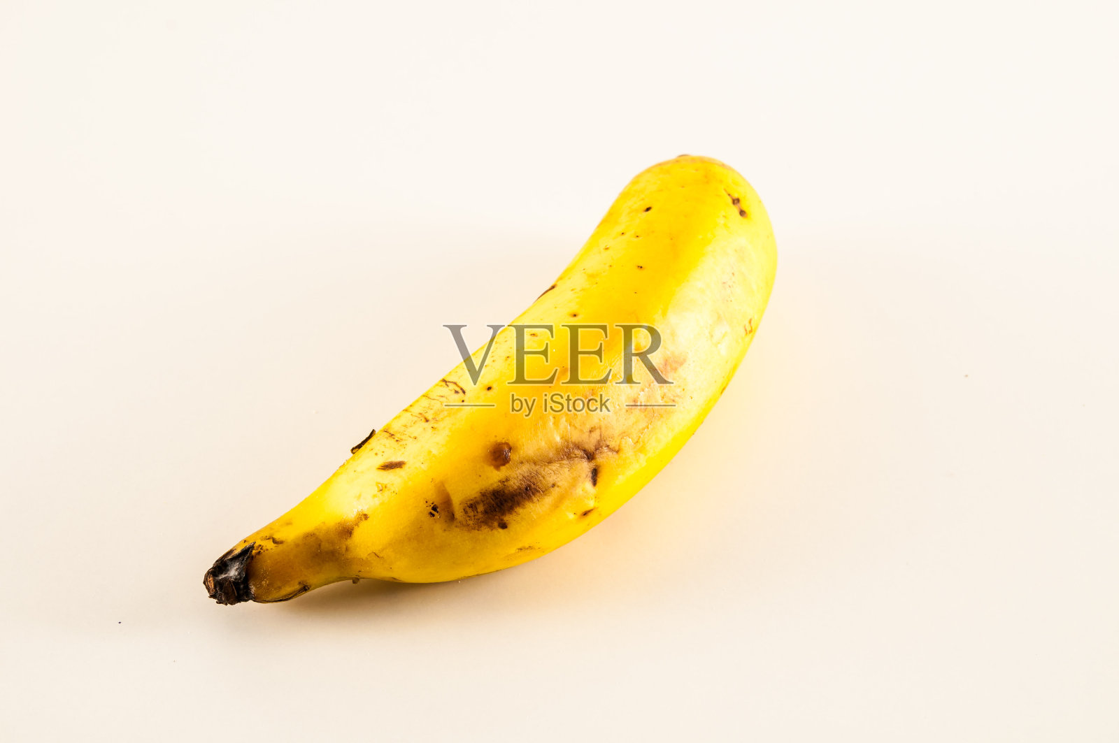 白色背景下的一根香蕉照片摄影图片