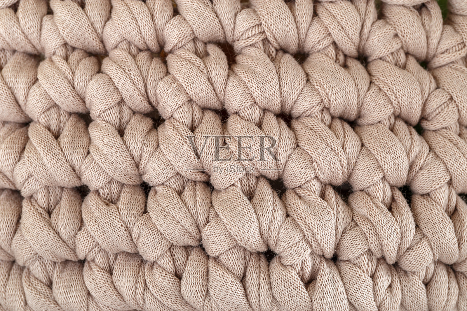 高细节手工编织的厚针织纱格呢。舒适的纹理模式照片摄影图片