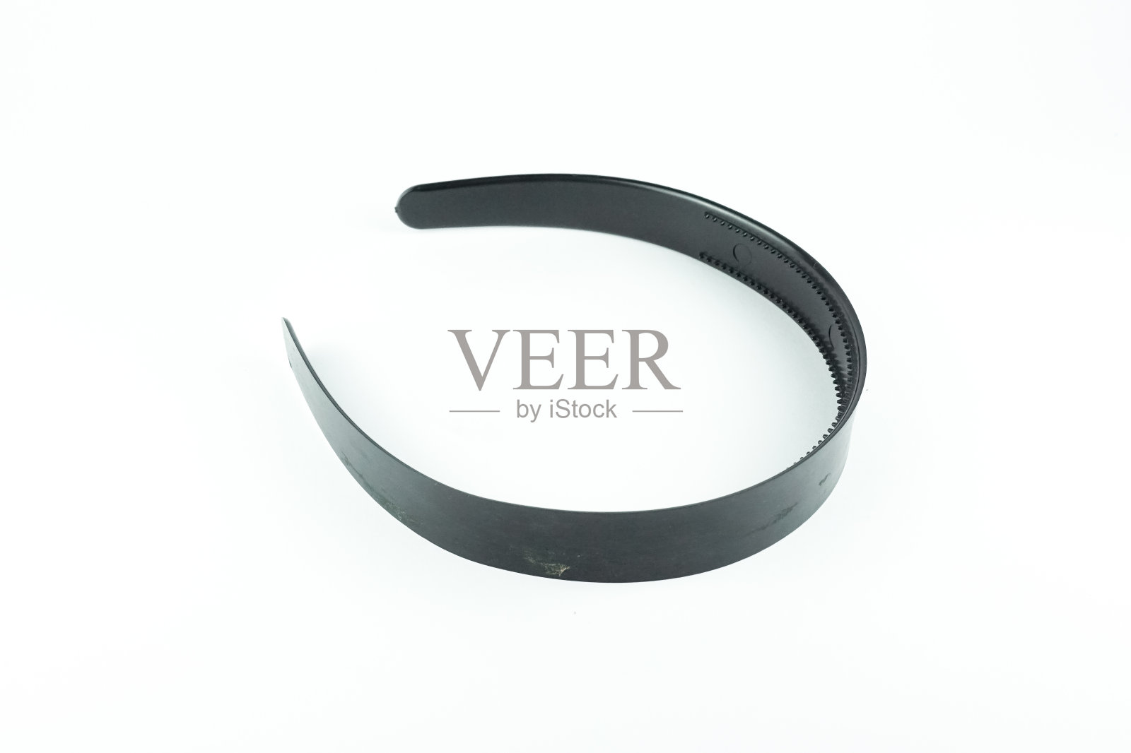 白色背景上黑色的塑料头带照片摄影图片