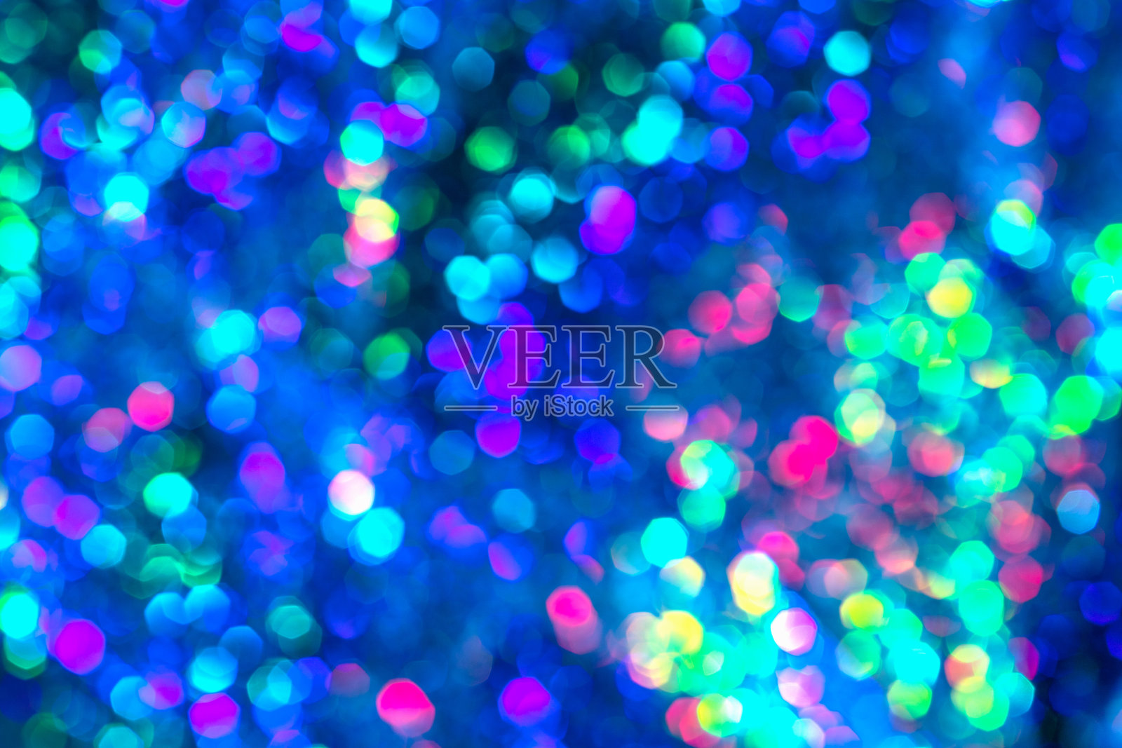 抽象蓝色散焦灯散景，圣诞假日蓝色闪亮背景照片摄影图片