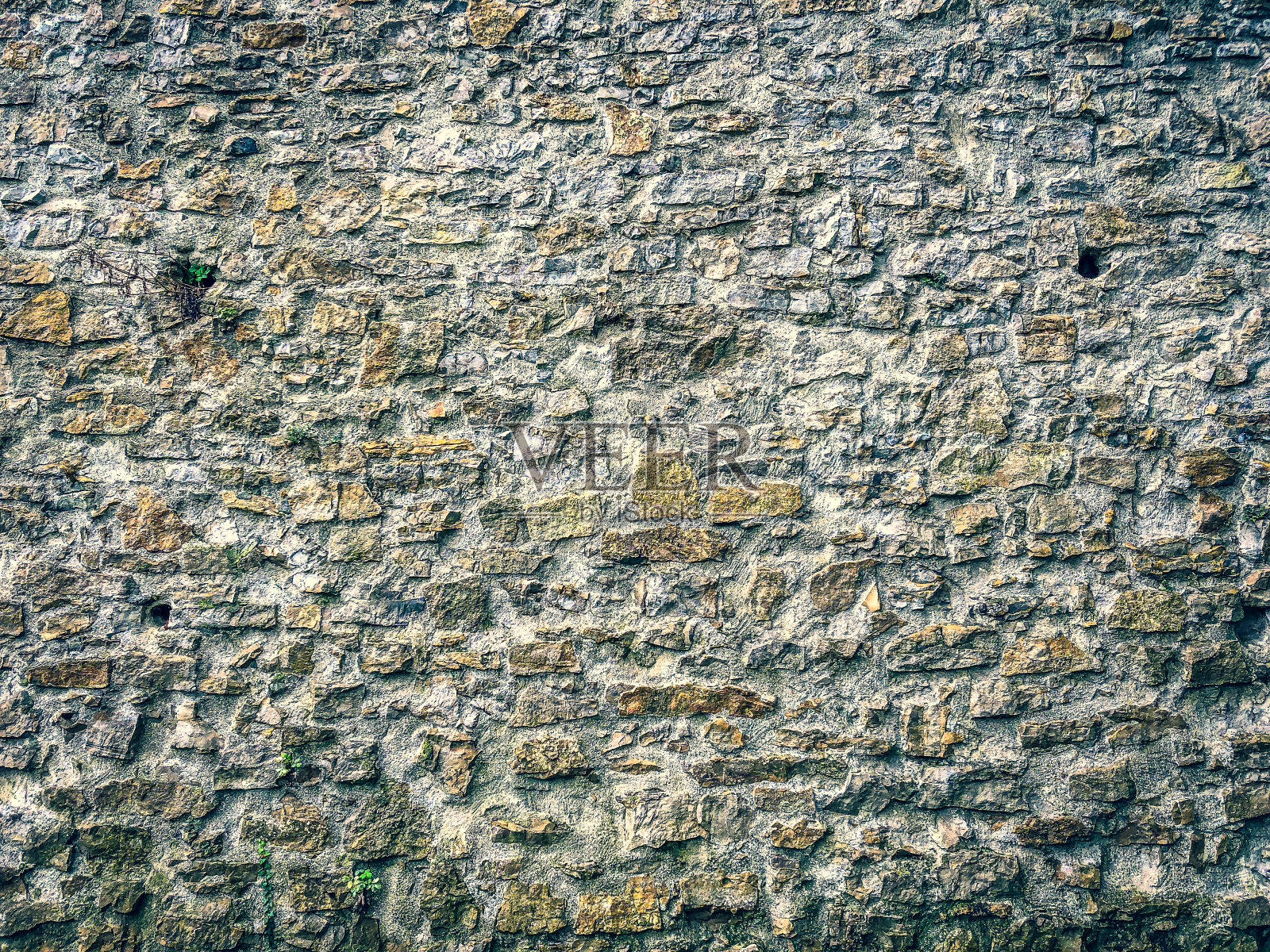 作为纹理或背景的石墙。照片摄影图片