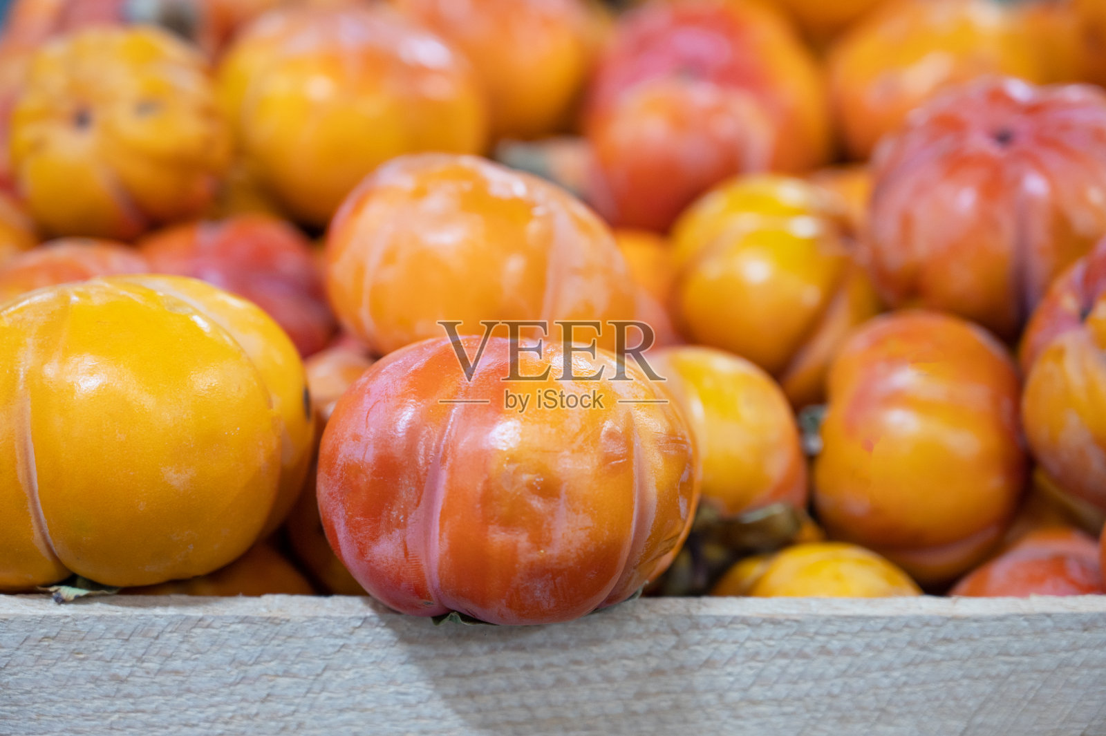 市场上的柿子照片摄影图片