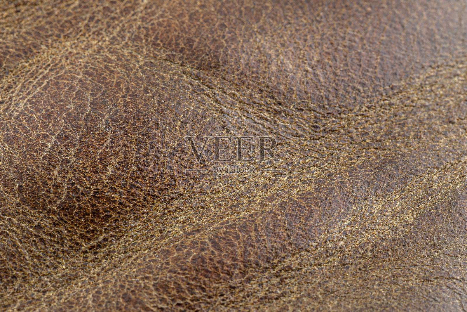 宏观背景制成无缝波浪形棕色天然皮革。照片摄影图片