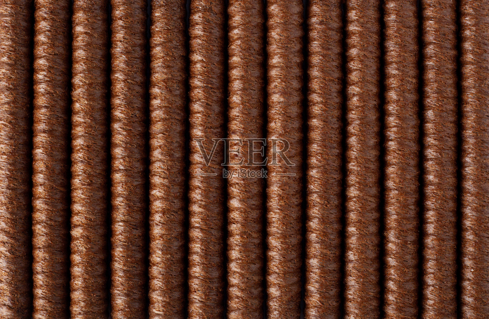 晶圆滚的背景。巧克力威化饼卷条排列整齐，填满整个画面。酥脆甜点背景概念照片摄影图片