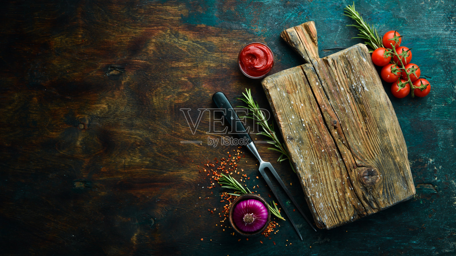 黑石烹饪背景。香料和蔬菜。前视图。为你的文本腾出空间。照片摄影图片