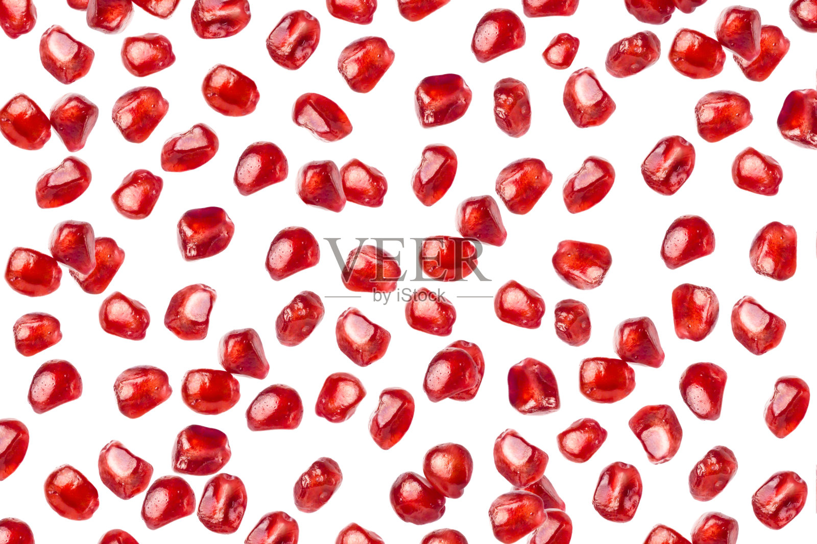 掉落的石榴籽孤立在白色的背景。照片摄影图片