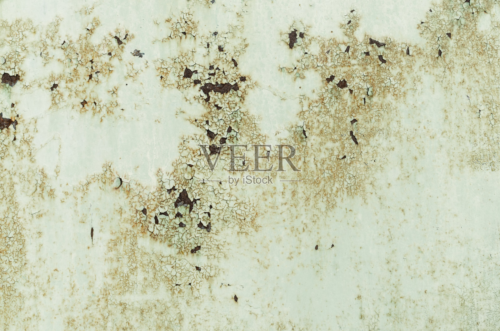 背景为绿色油漆的生锈金属。照片摄影图片