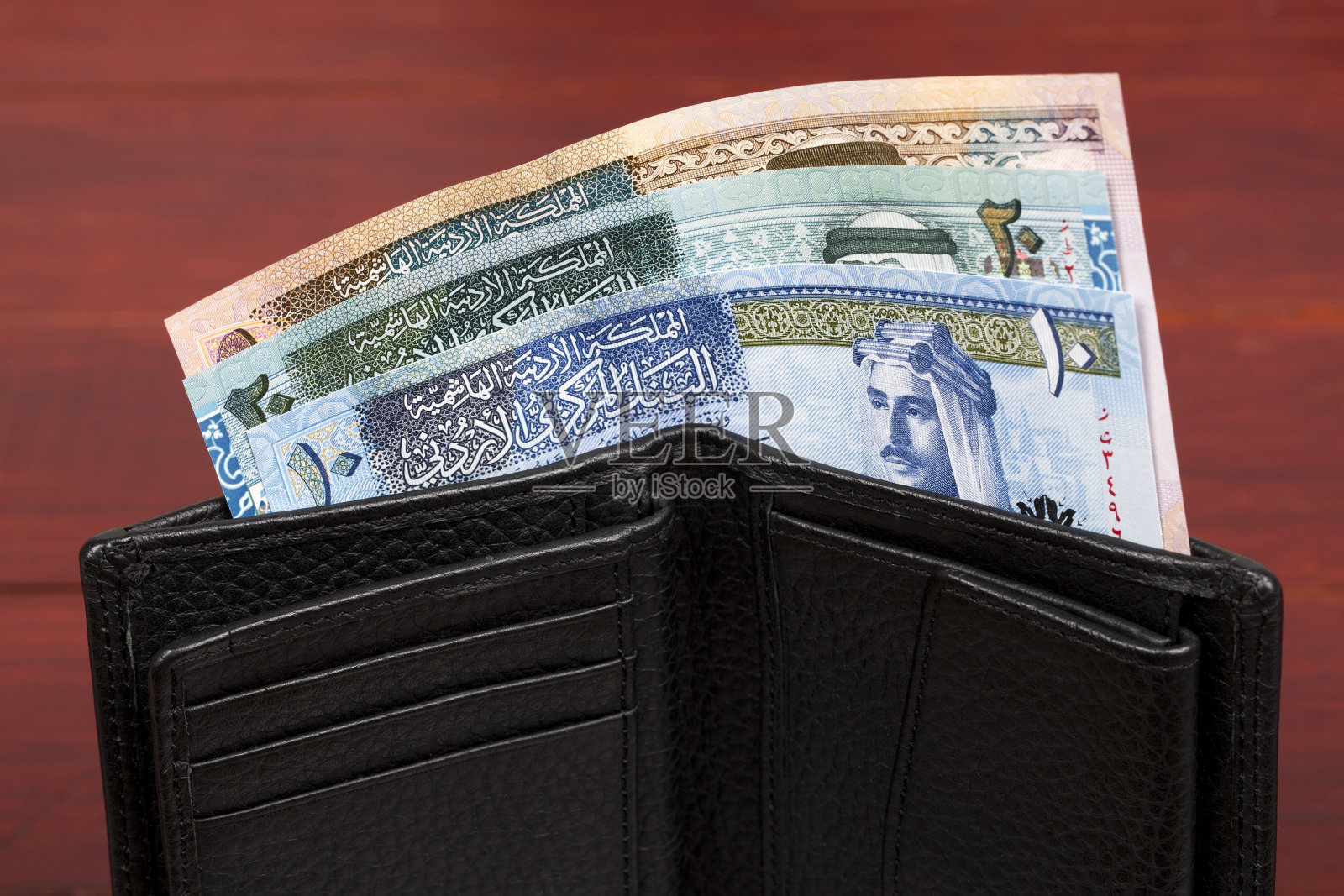 黑色钱包里的约旦钱照片摄影图片
