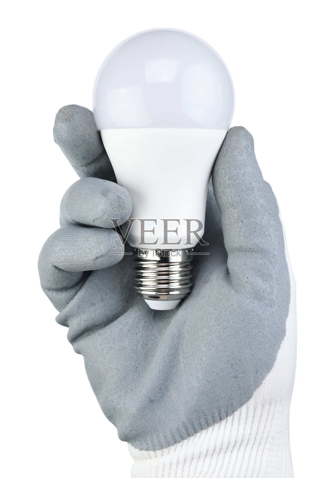 一个电工的手在一个保护手套握着一个现代圆形LED灯泡在一个白色的背景特写。照片摄影图片