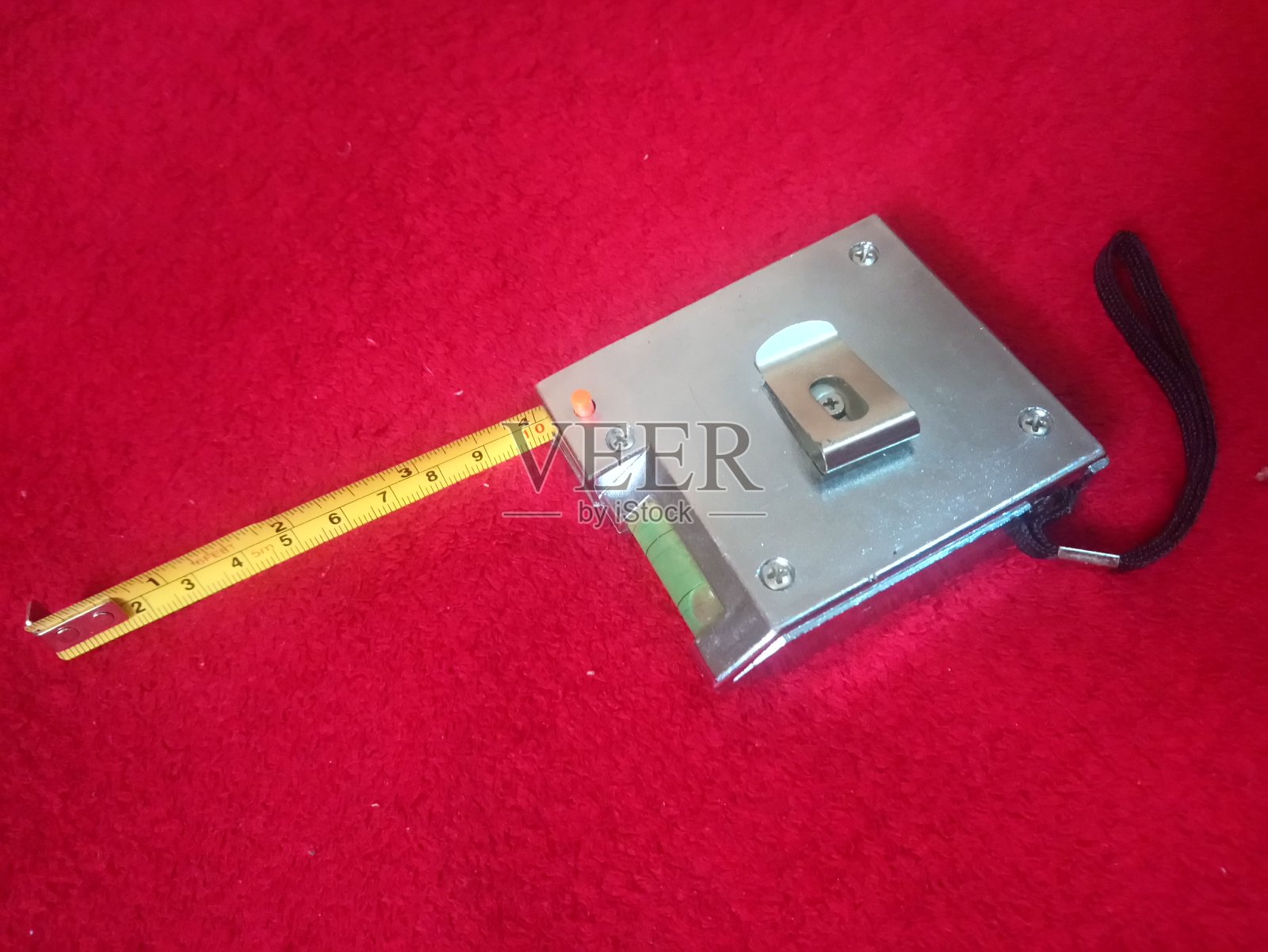 卷尺测量装置，主要用于建筑中，它还有一个矫直机照片摄影图片