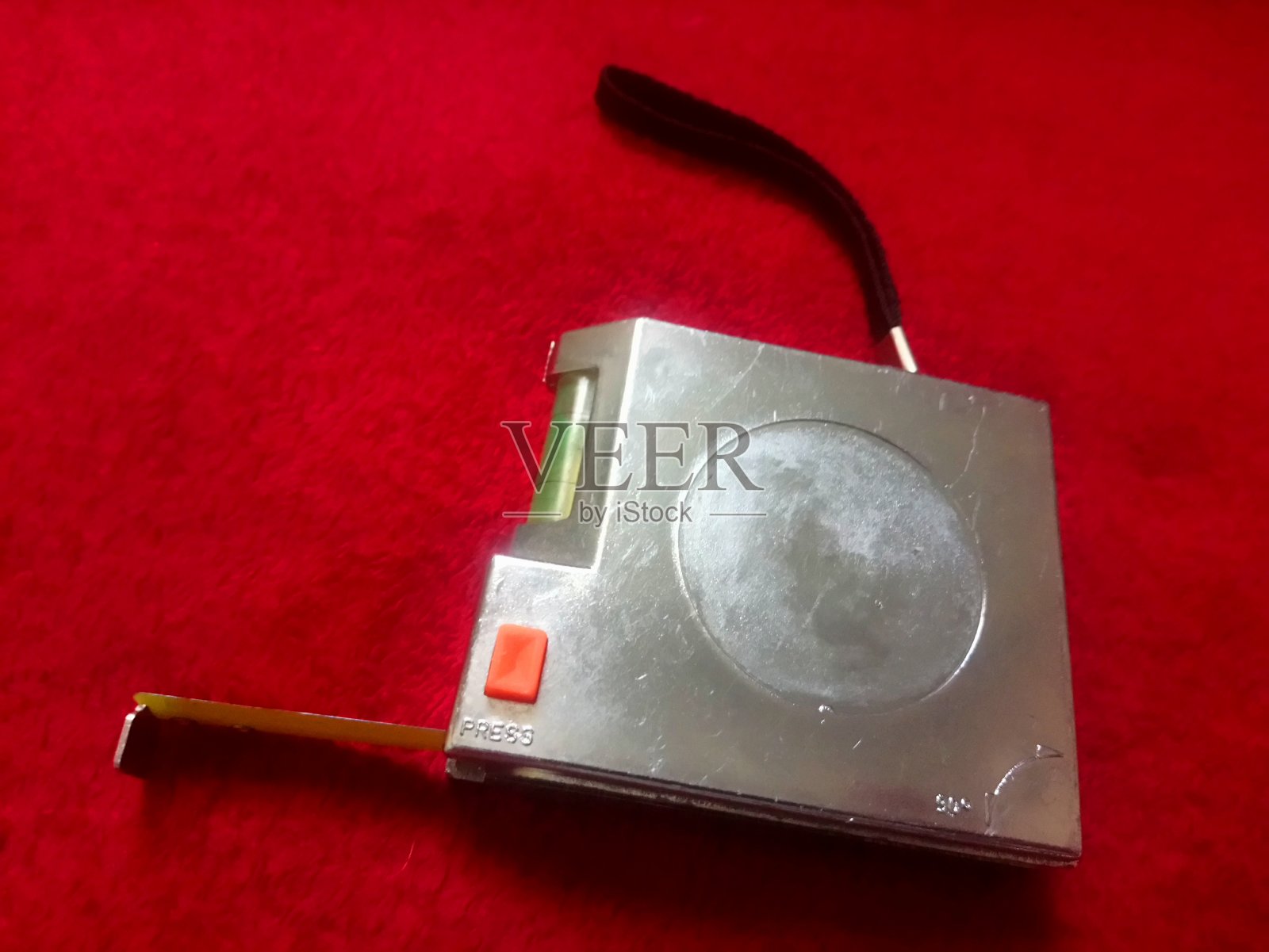 卷尺测量装置，主要用于建筑中，它还有一个矫直机照片摄影图片