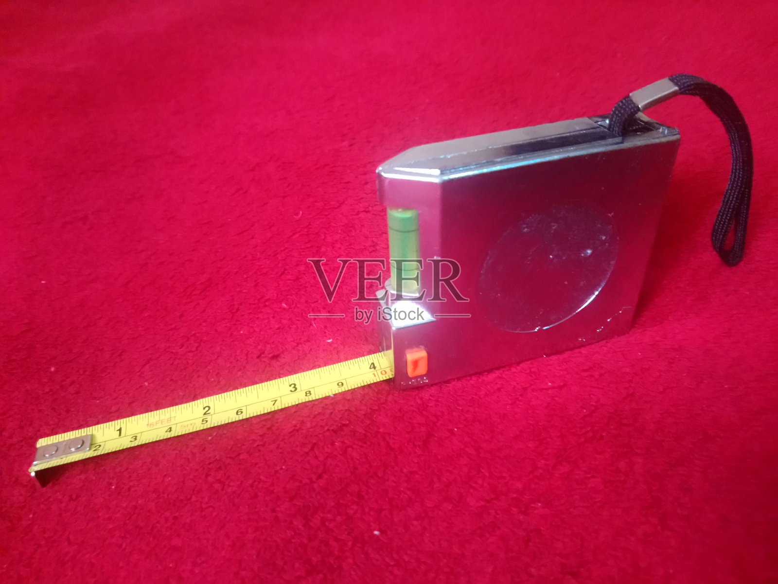 卷尺测量装置，主要用于建筑中，它还有一个矫直机照片摄影图片