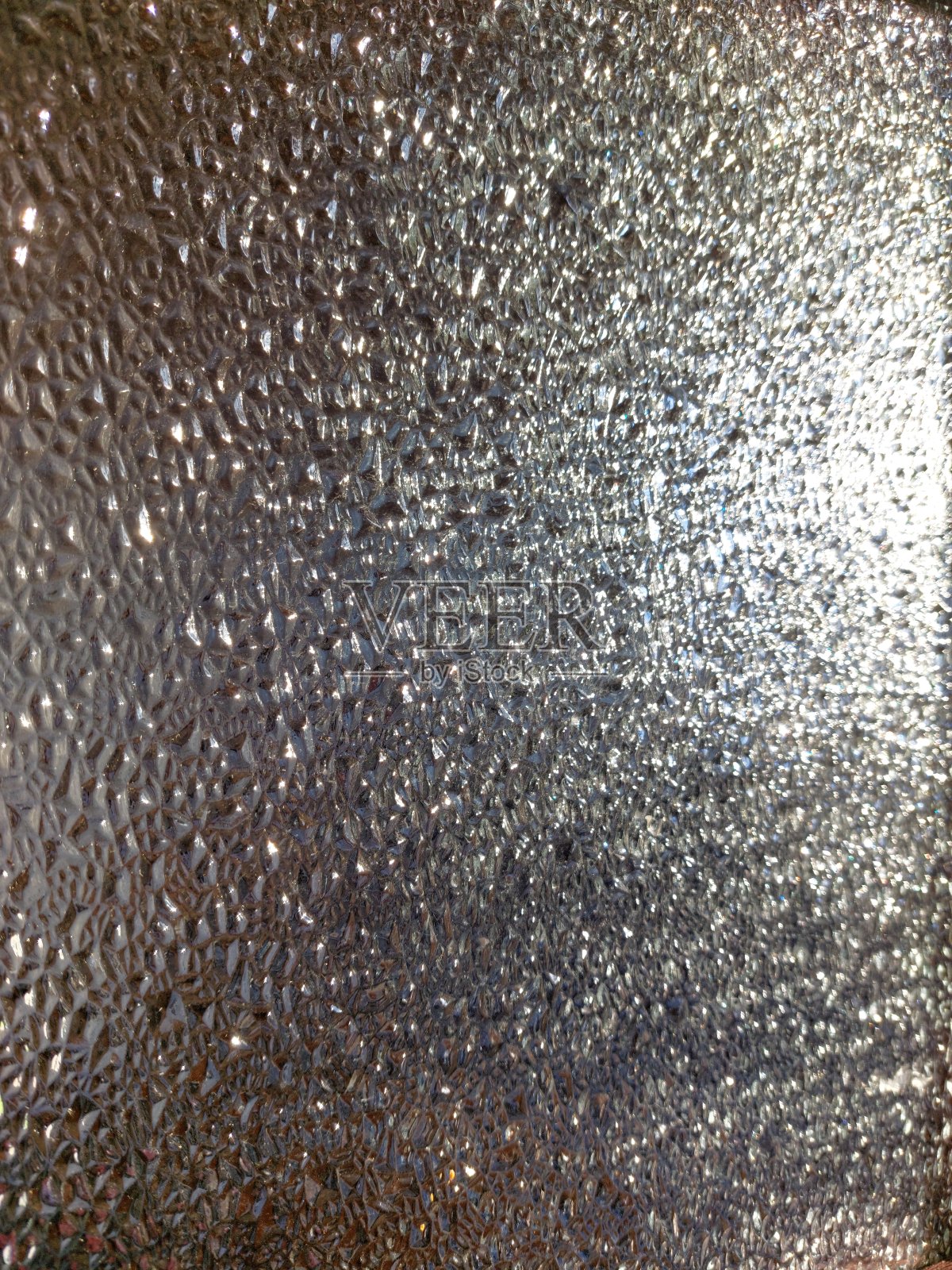 玻璃浮雕表面的照片特写与折射光凹凸不平的纹理背景照片摄影图片