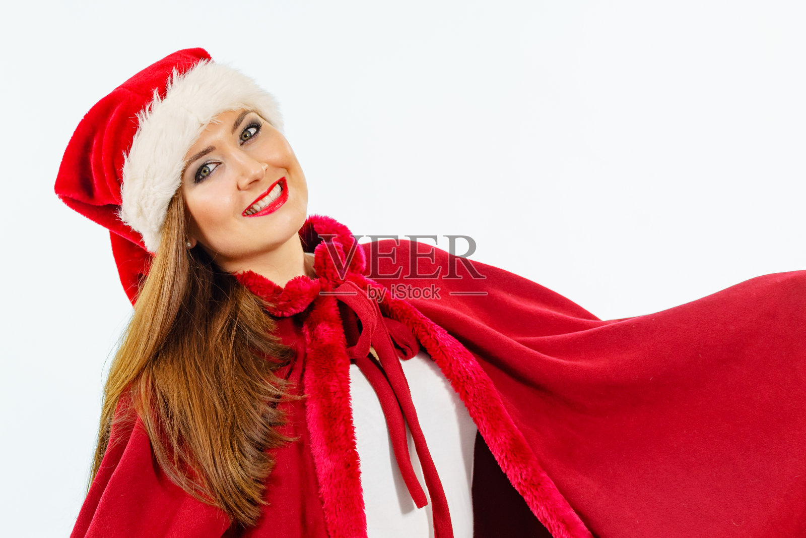 戴着圣诞老人帽子的微笑女人照片摄影图片