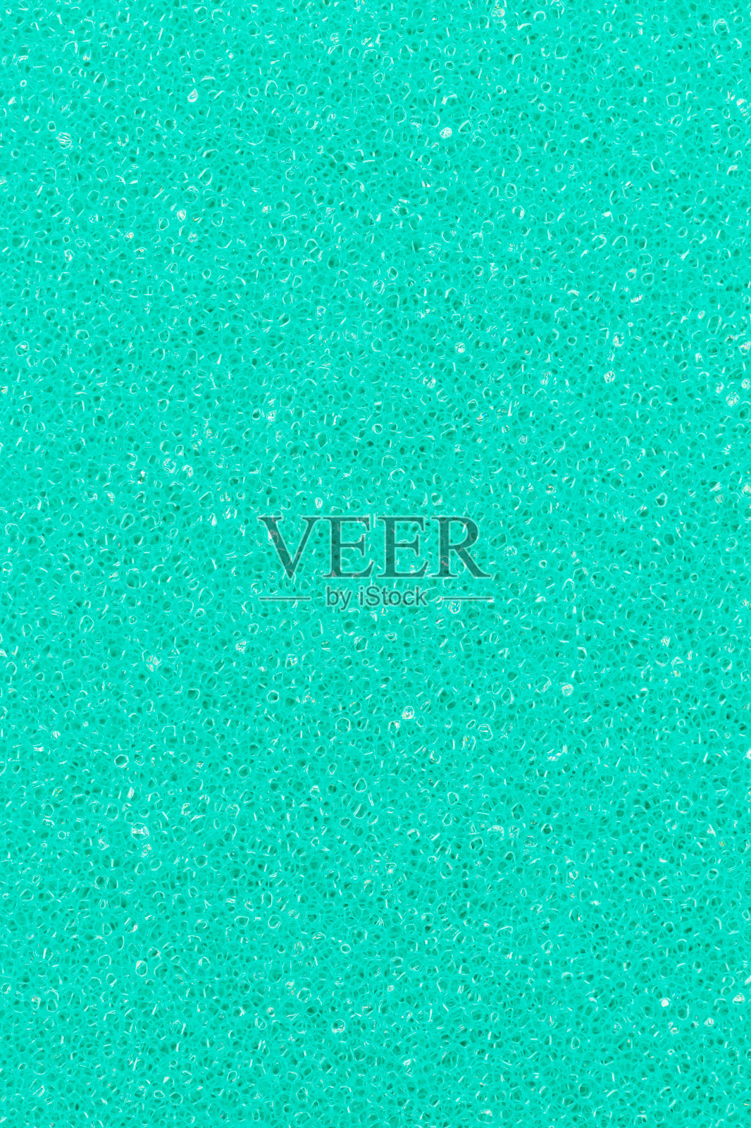 蓝绿色泡沫多孔抽象背景。垂直构图设计，彩色背景照片摄影图片