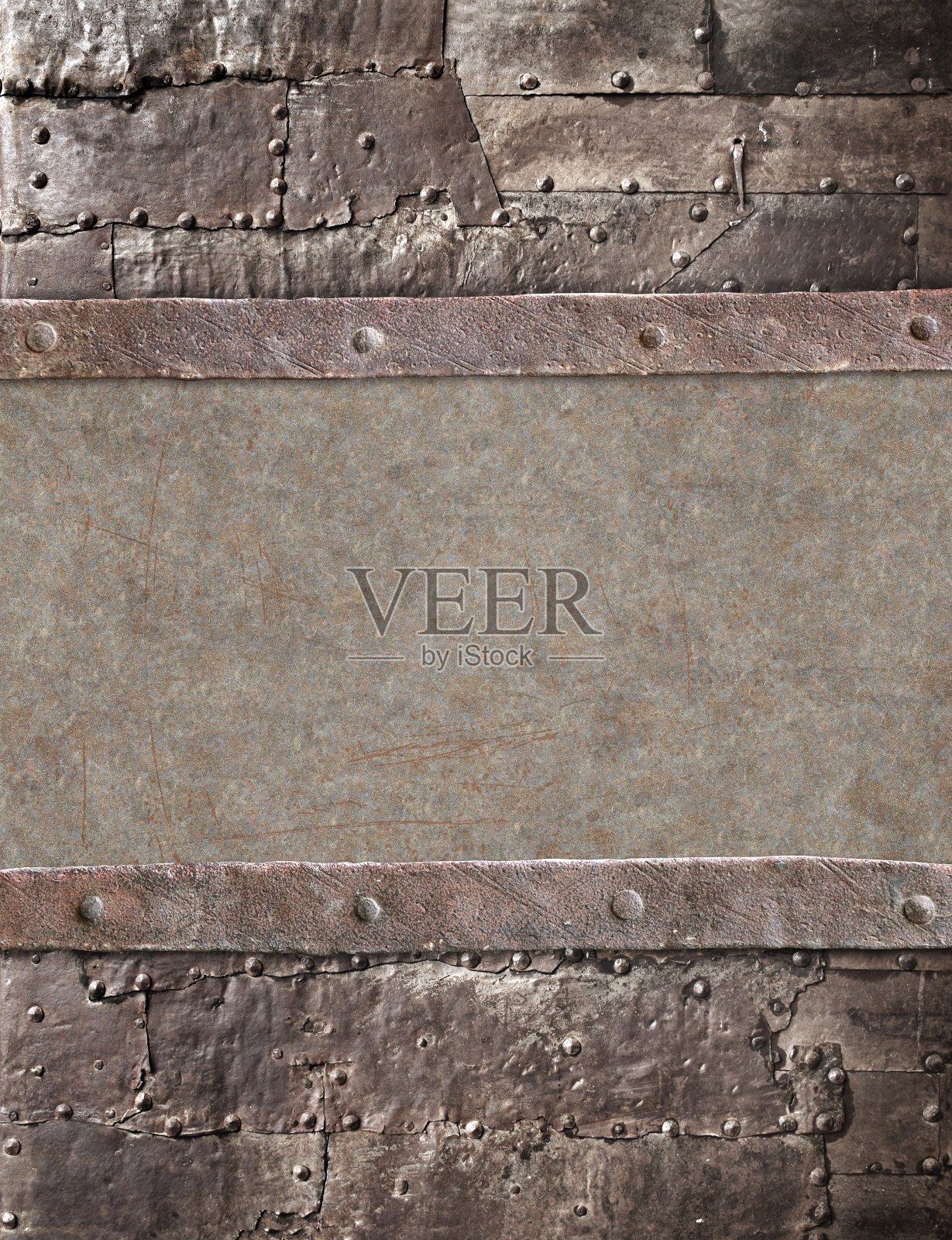 蒸汽朋克风格的Grunge背景。旧金属的纹理，铆钉和生锈的框架照片摄影图片