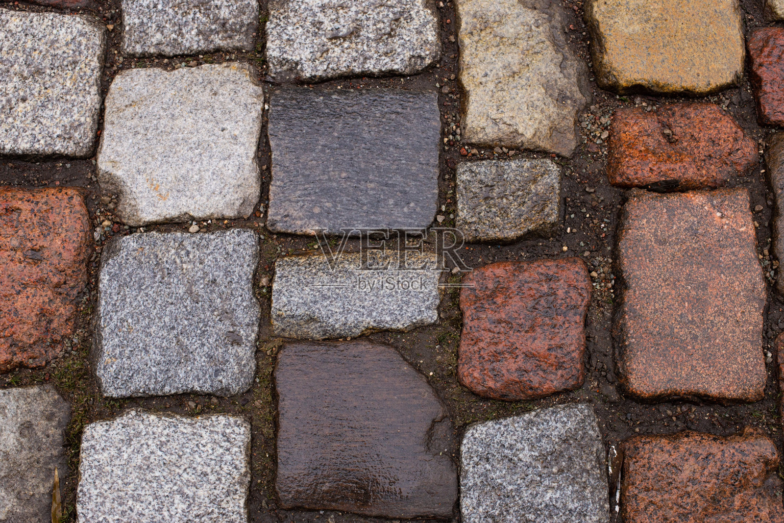 古旧黄灰红石路背景纹理。照片摄影图片