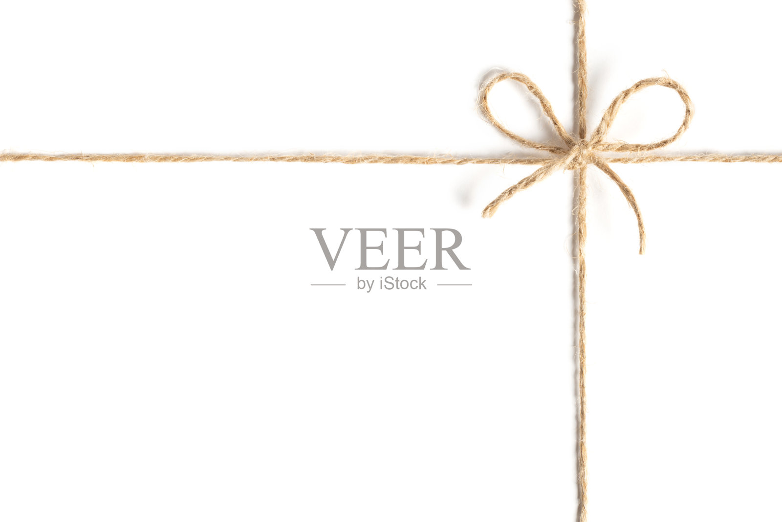 特写的绳子绑在一个蝴蝶结在白色的背景照片摄影图片