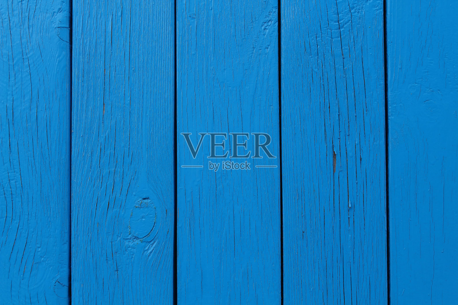 这所房子的墙是用蓝色的木板做的。特写镜头。背景。纹理。照片摄影图片