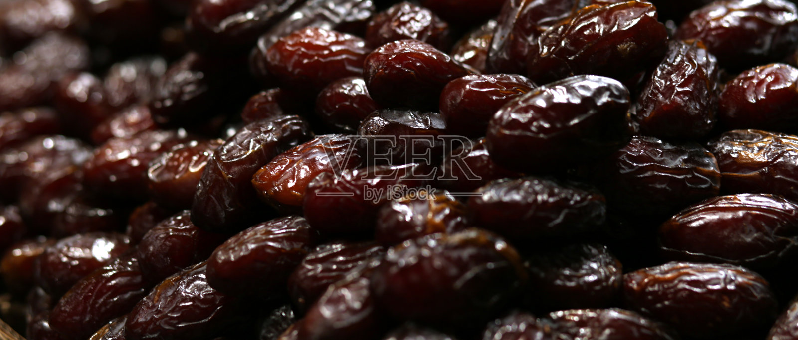 Medjool枣干水果栈堆食物背景微距摄影照片摄影图片