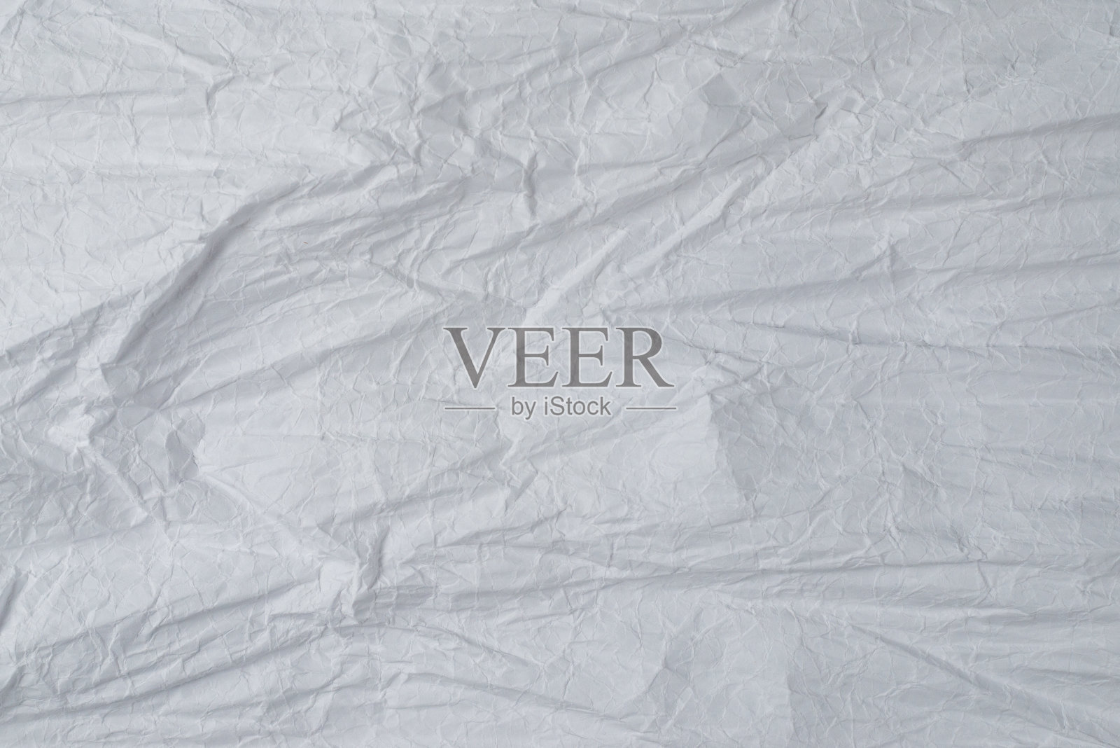 皱巴巴的白纸背景。照片摄影图片