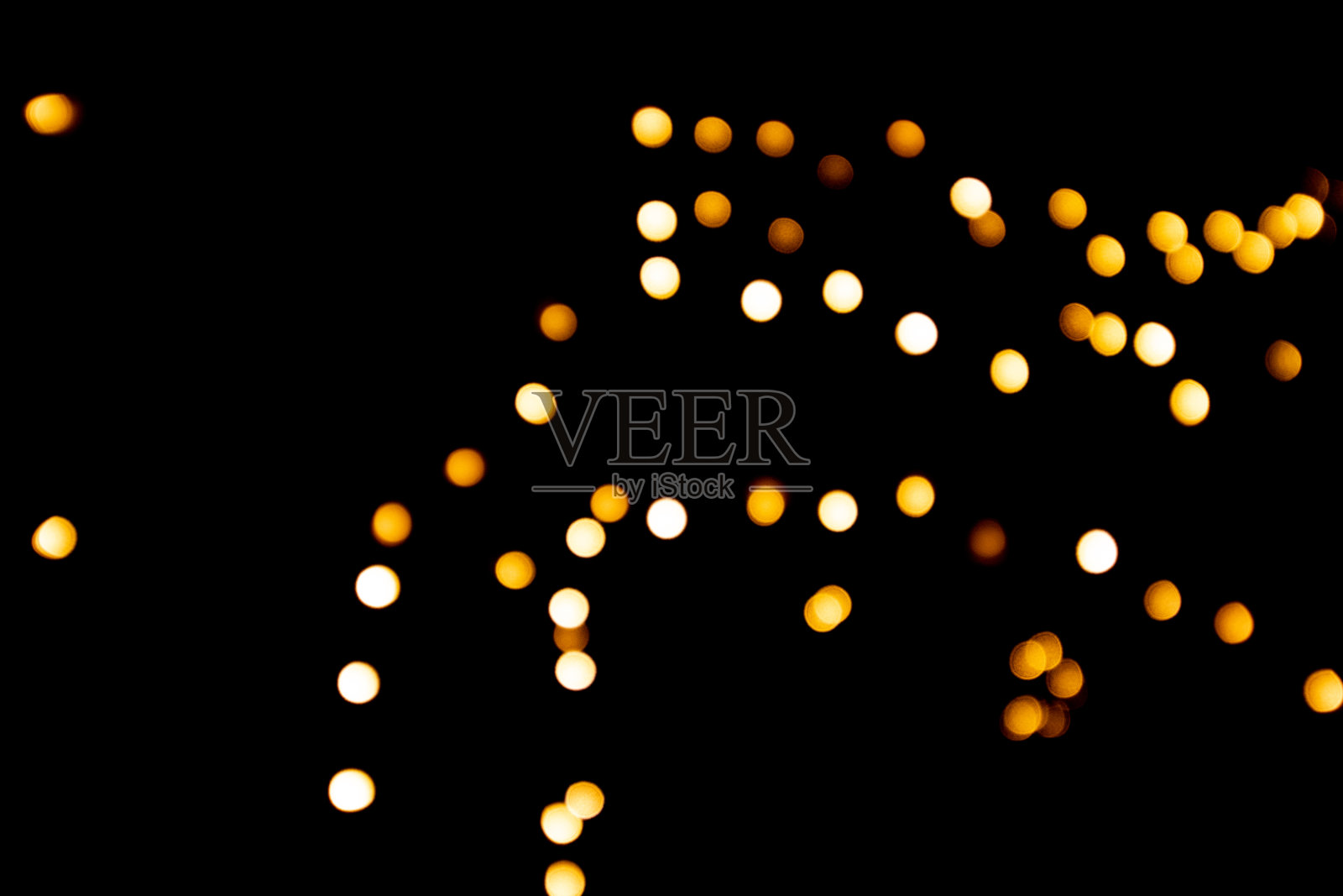 圣诞装饰，散景，金色和白色的灯，背景照明。照片摄影图片