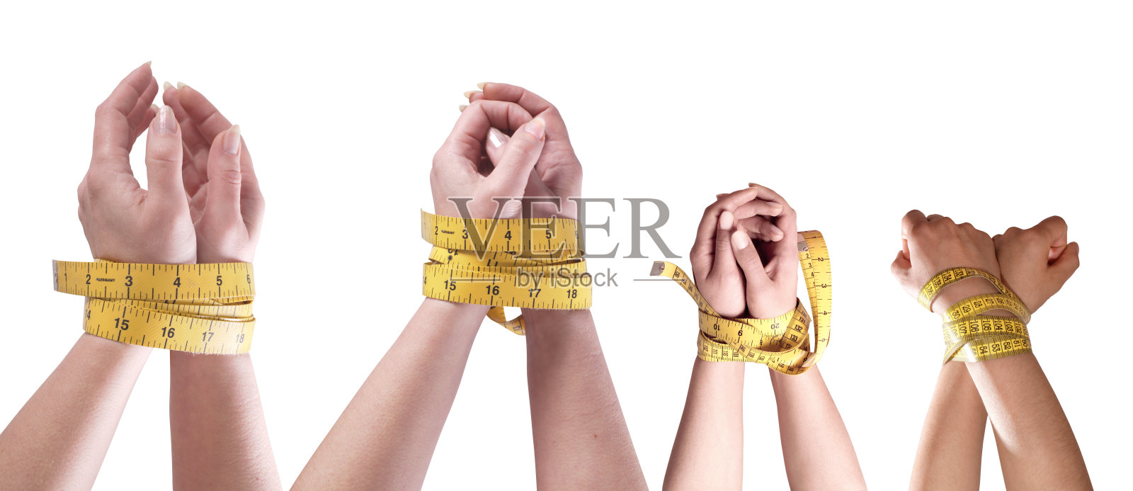 节食概念的手绑在卷尺变化的白色背景上照片摄影图片