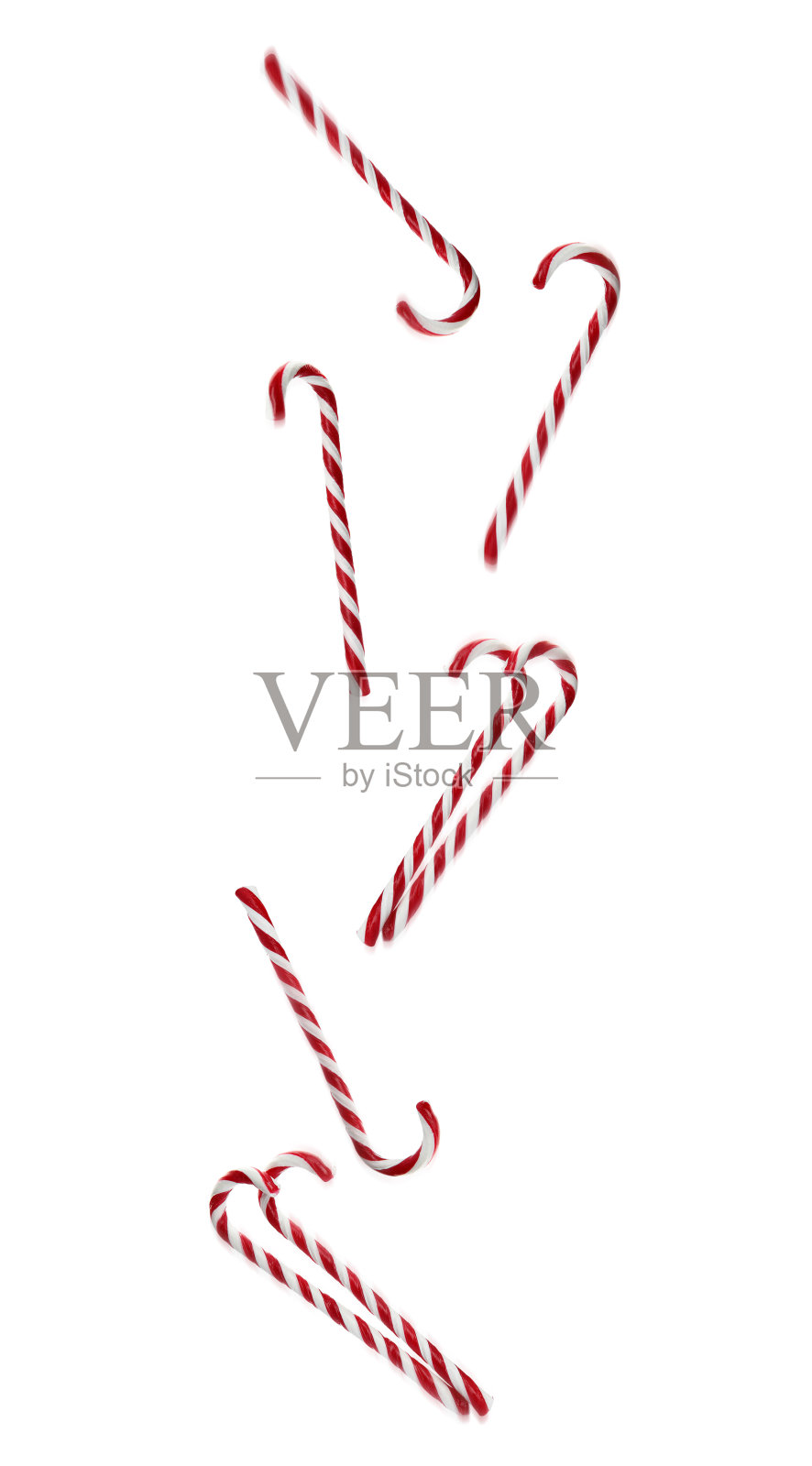 美味的圣诞糖果棒落在白色的背景上照片摄影图片