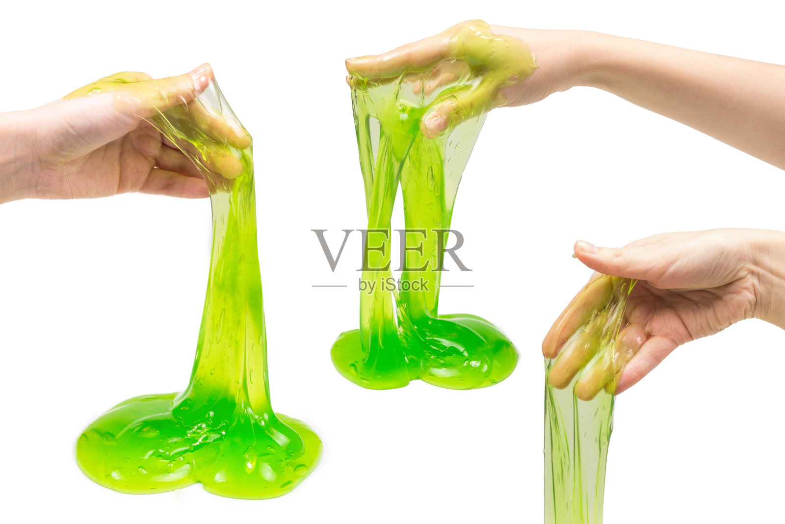 绿色的粘液玩具在女人手上孤立在白色上。照片摄影图片