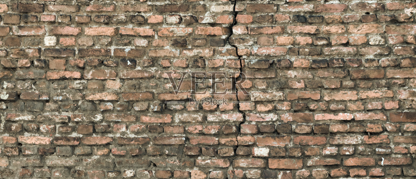棕色旧砖墙有裂缝照片摄影图片