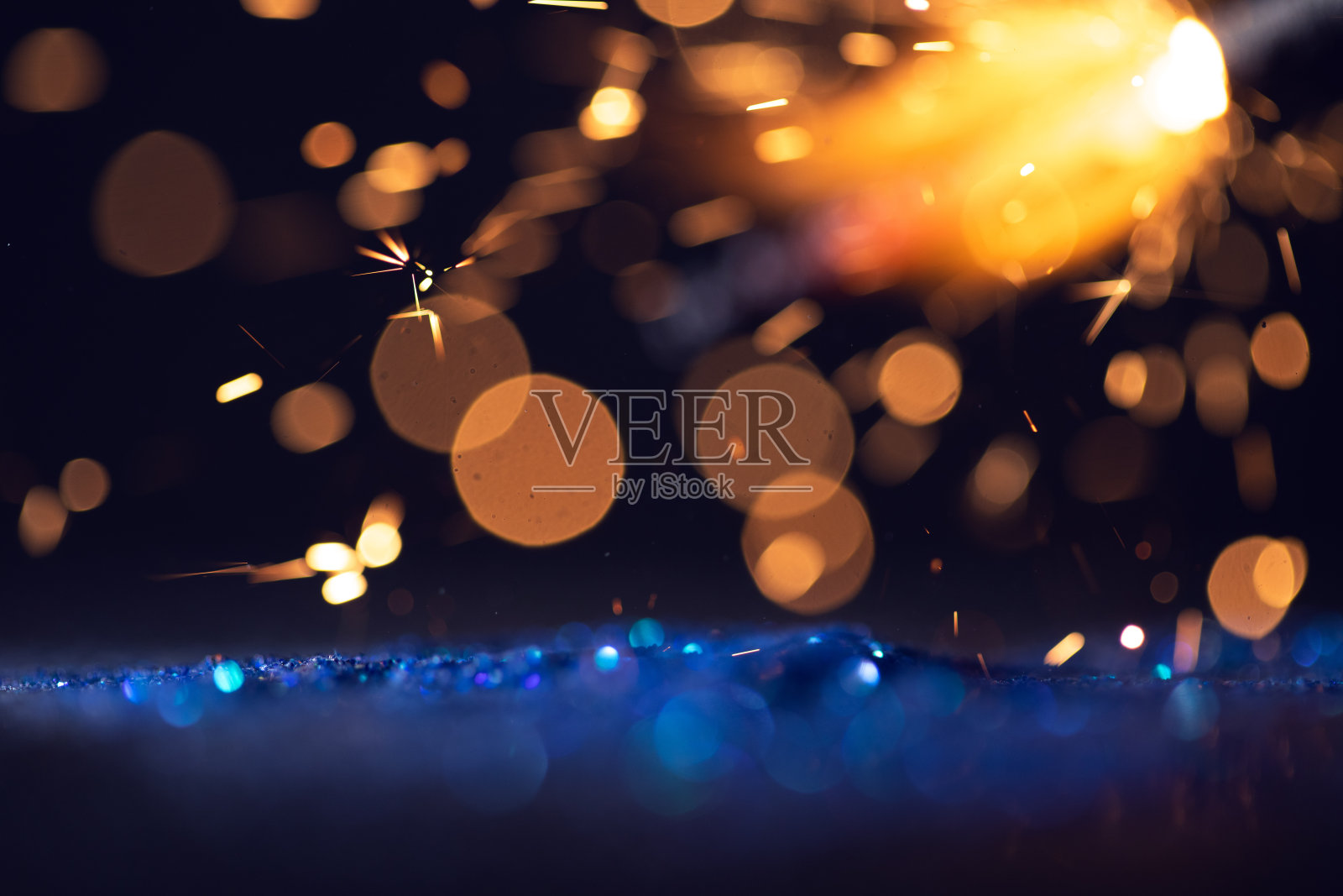 背景的抽象闪光灯。金色，蓝色和黑色照片摄影图片