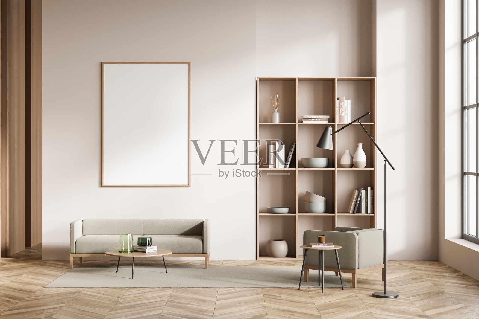 明亮的客房内部配有扶手椅和沙发，书架和模型海报照片摄影图片