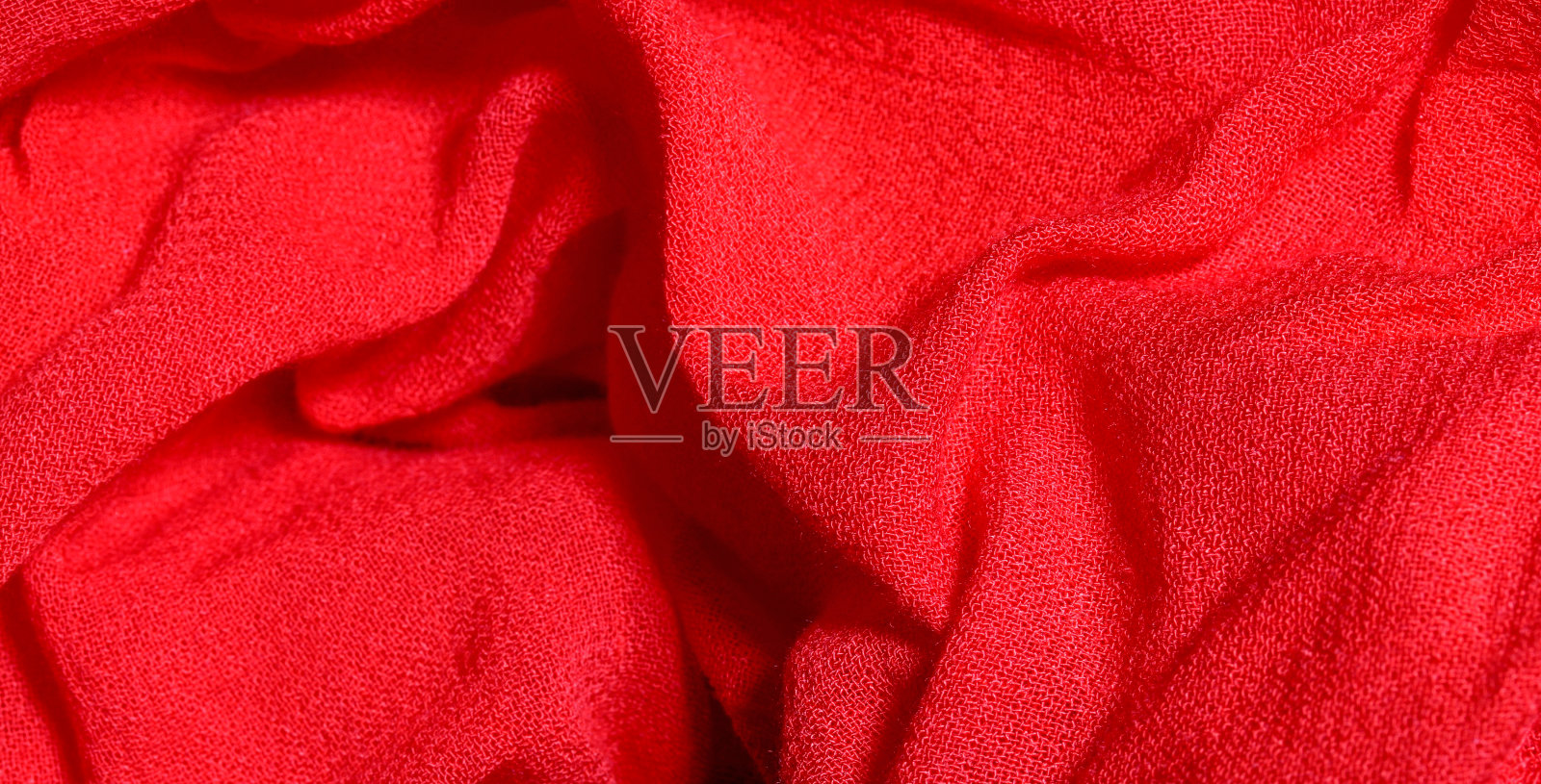 红色织物纹理背景的特写照片摄影图片