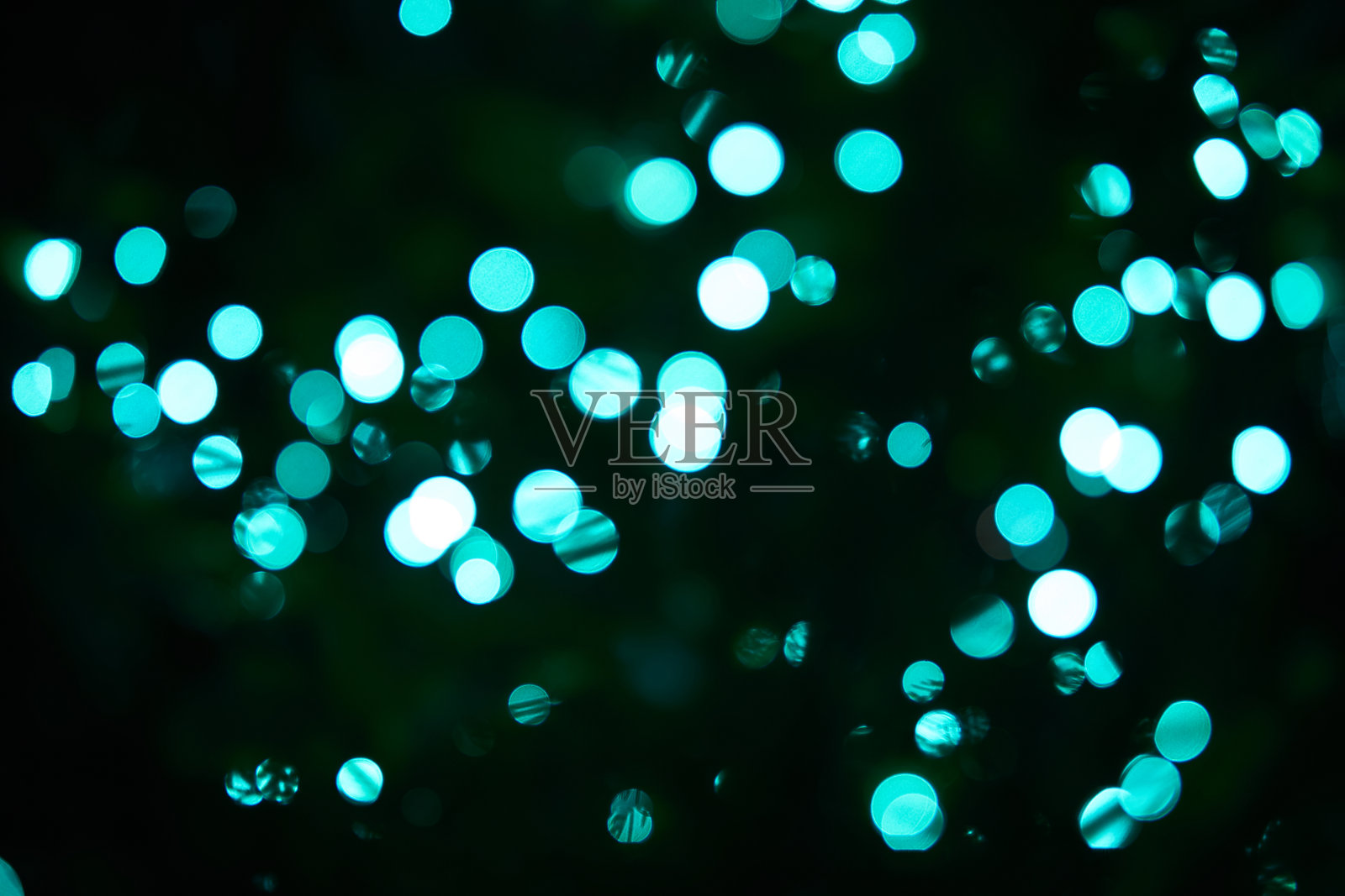 蓝色模糊散景背景，闪光，灯光效果，派对。模糊光抽象背景与散景散焦光照片摄影图片