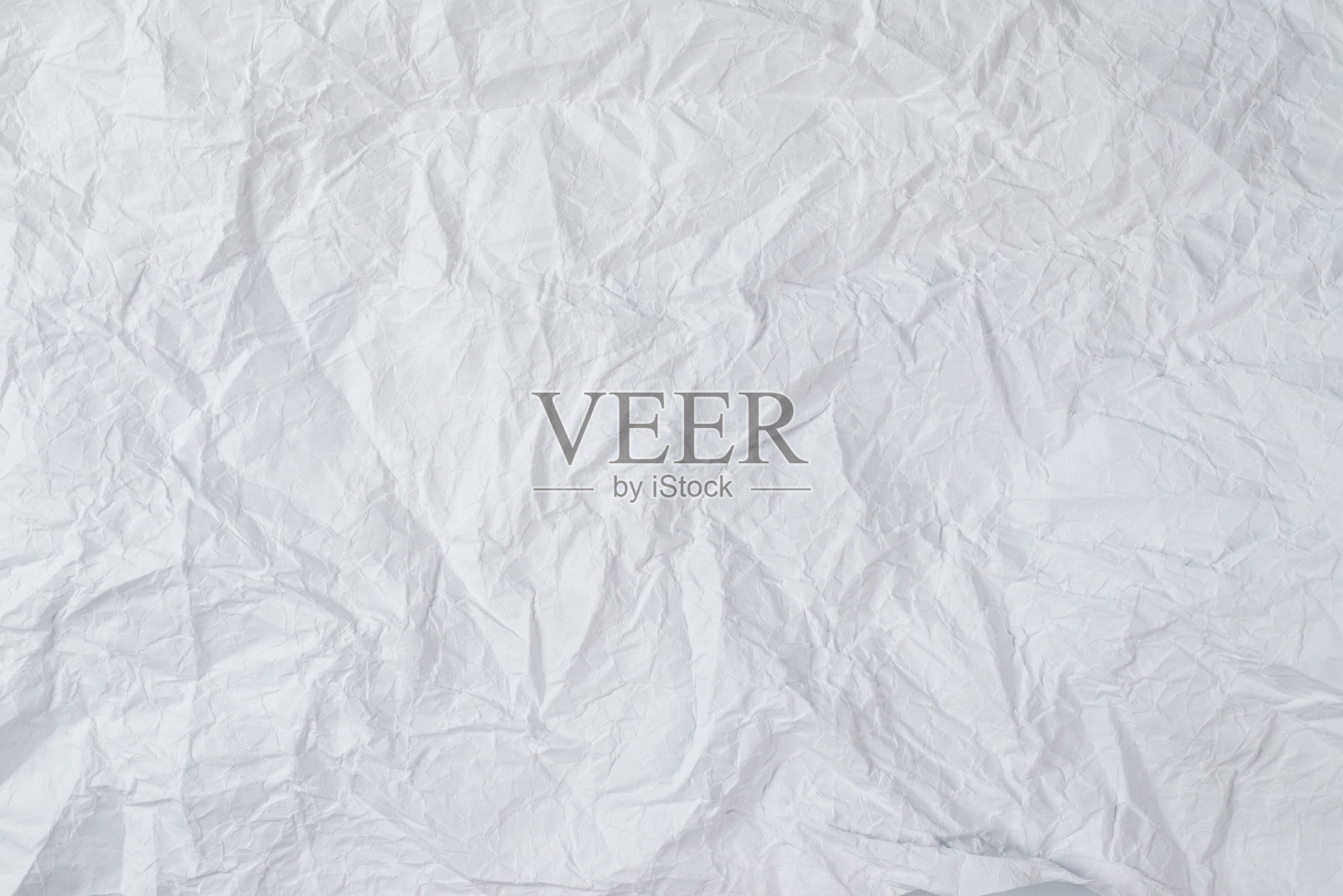 皱巴巴的白纸背景。照片摄影图片