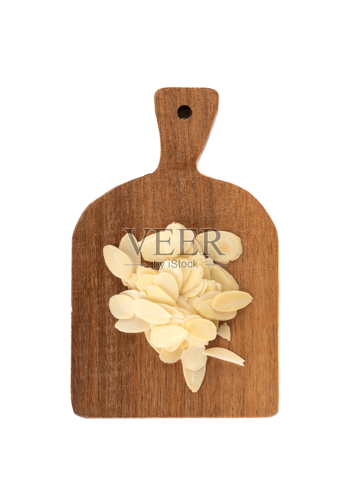 俯视图的一个小砧板与杏仁花瓣从坚果仁。照片摄影图片