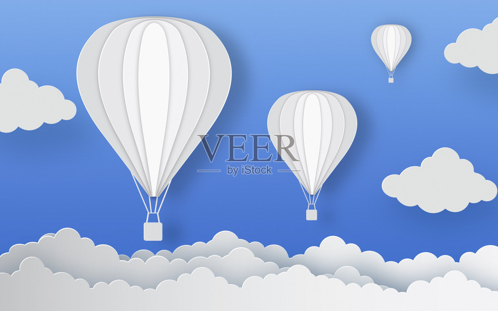 蓝色纸背景上的热气球和云彩照片摄影图片