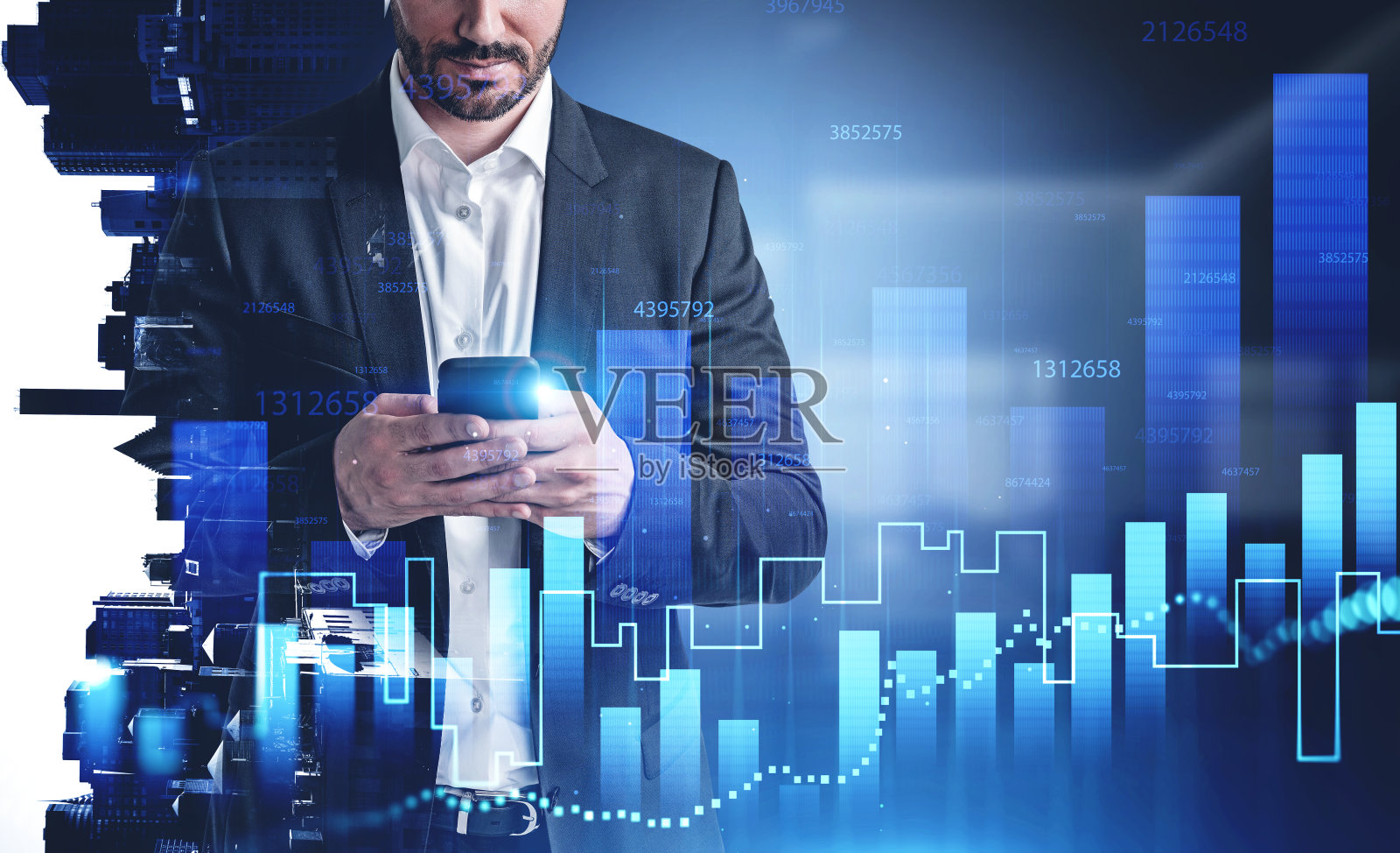 一名男子在城市办公室使用智能手机，图表照片摄影图片