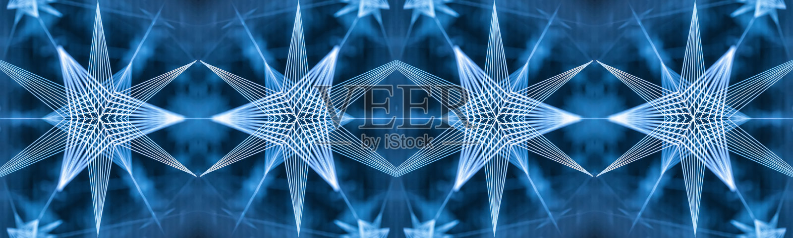 抽象的万花筒的背景。美丽的彩色万花筒纹理。设计独特的万花筒。照片摄影图片