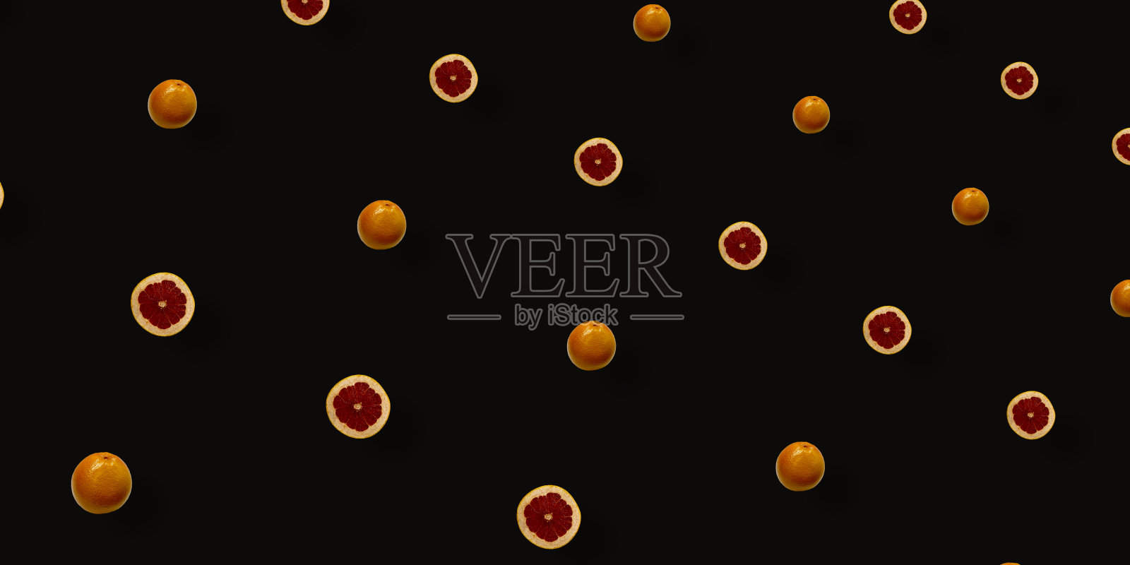 鲜艳的水果图案，新鲜的葡萄柚在黑色的背景上。前视图。平的。波普艺术设计照片摄影图片