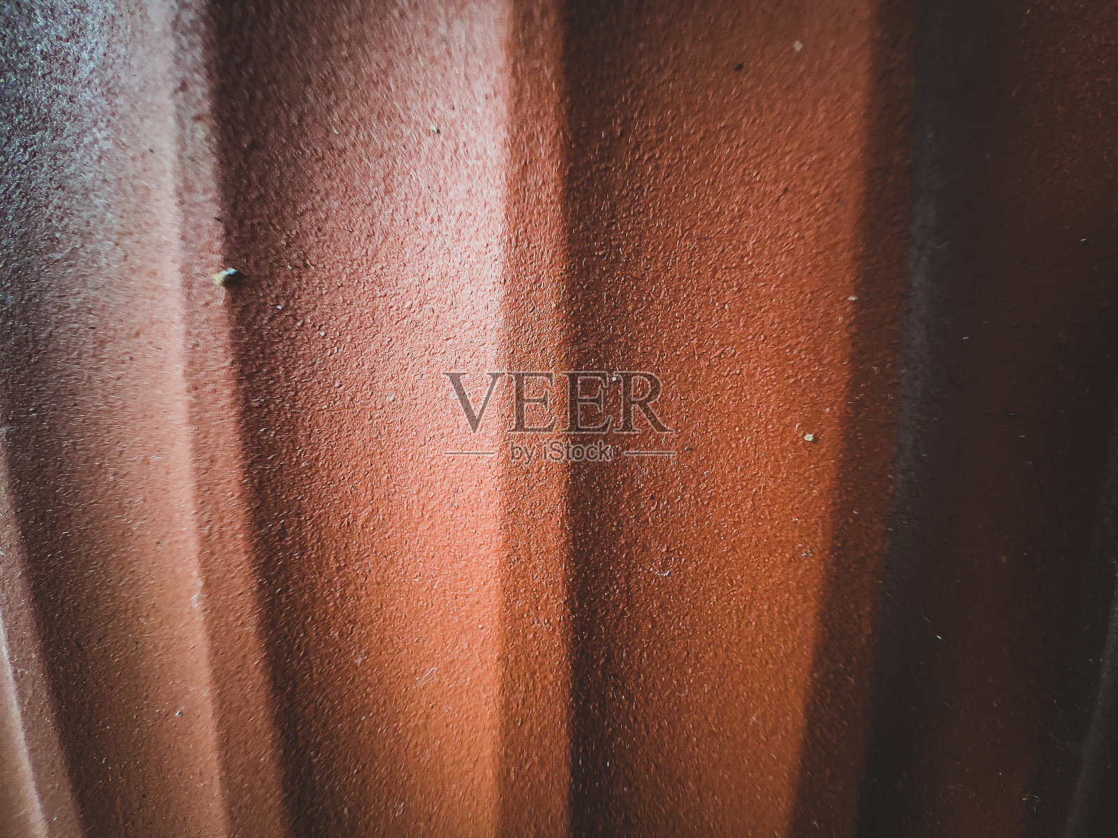 带有波浪的棕色塑料。照片摄影图片