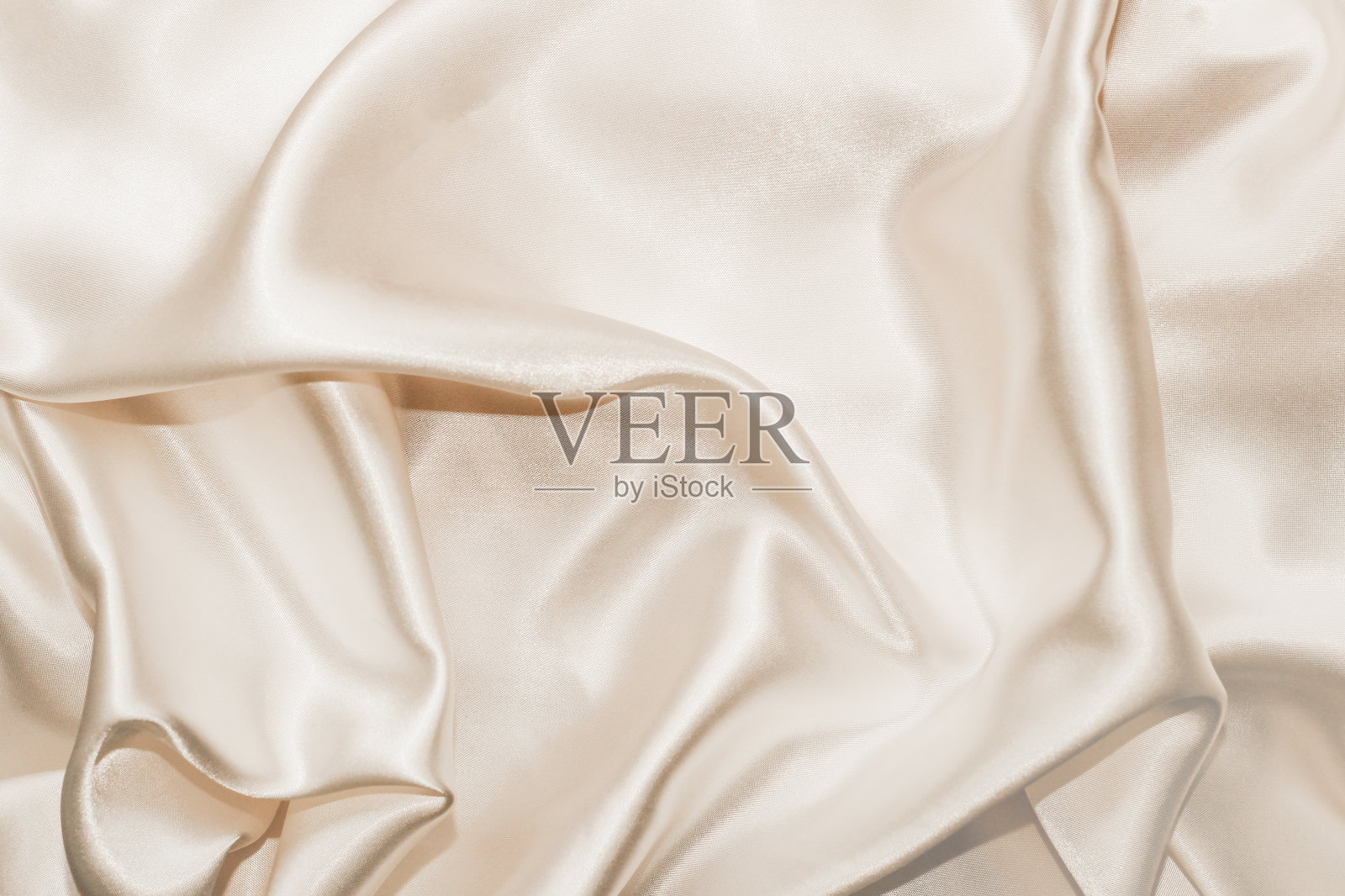 丝质背景的面料光泽细腻，为文字留出空间照片摄影图片